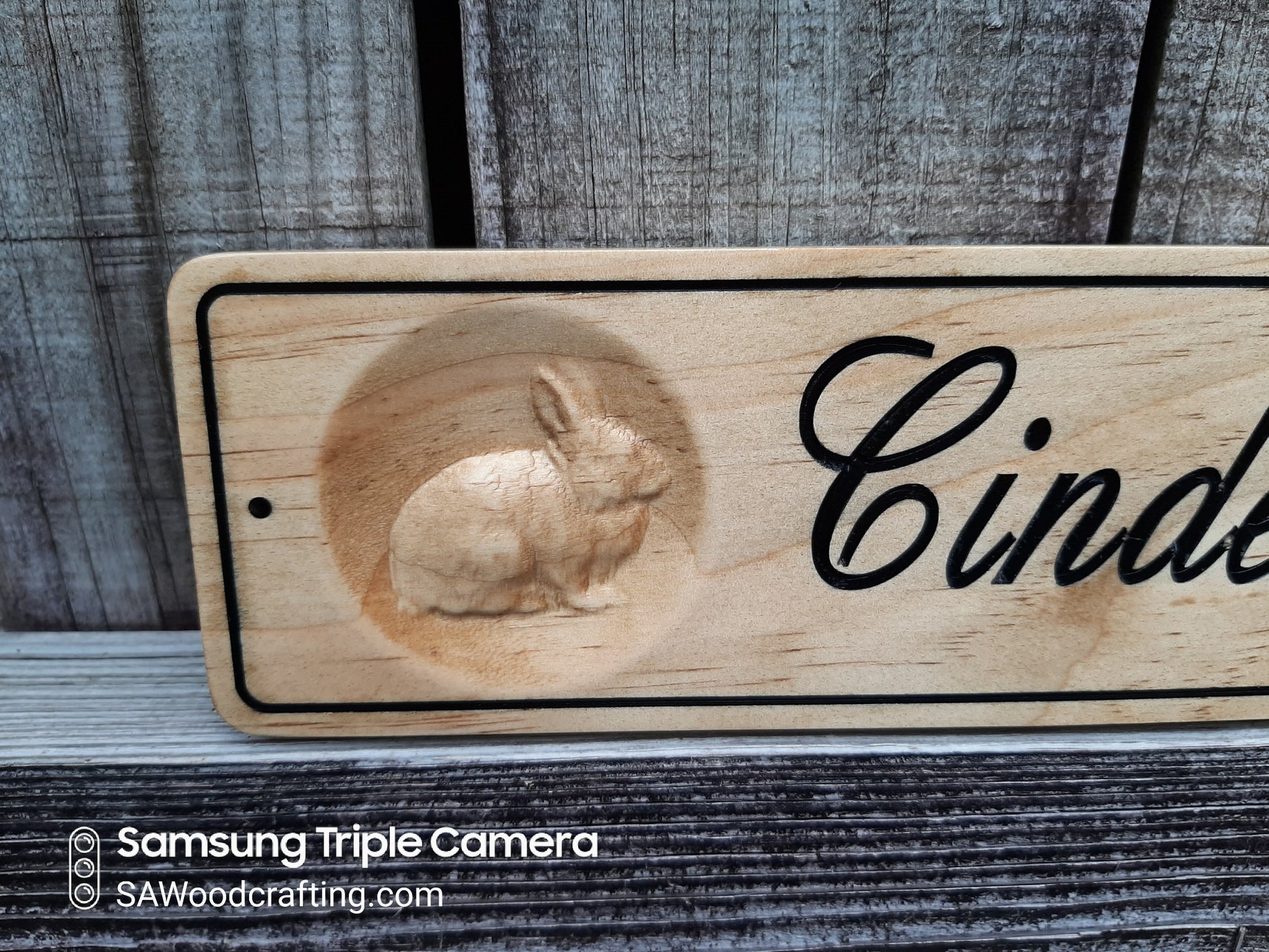 wood carved sign with rabbits made in the USA.