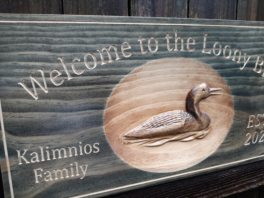 Custom made solid wooden Family name sign with 3D wood carved graphics. Hunting family last name sign with Loon bird. Made in the USA.