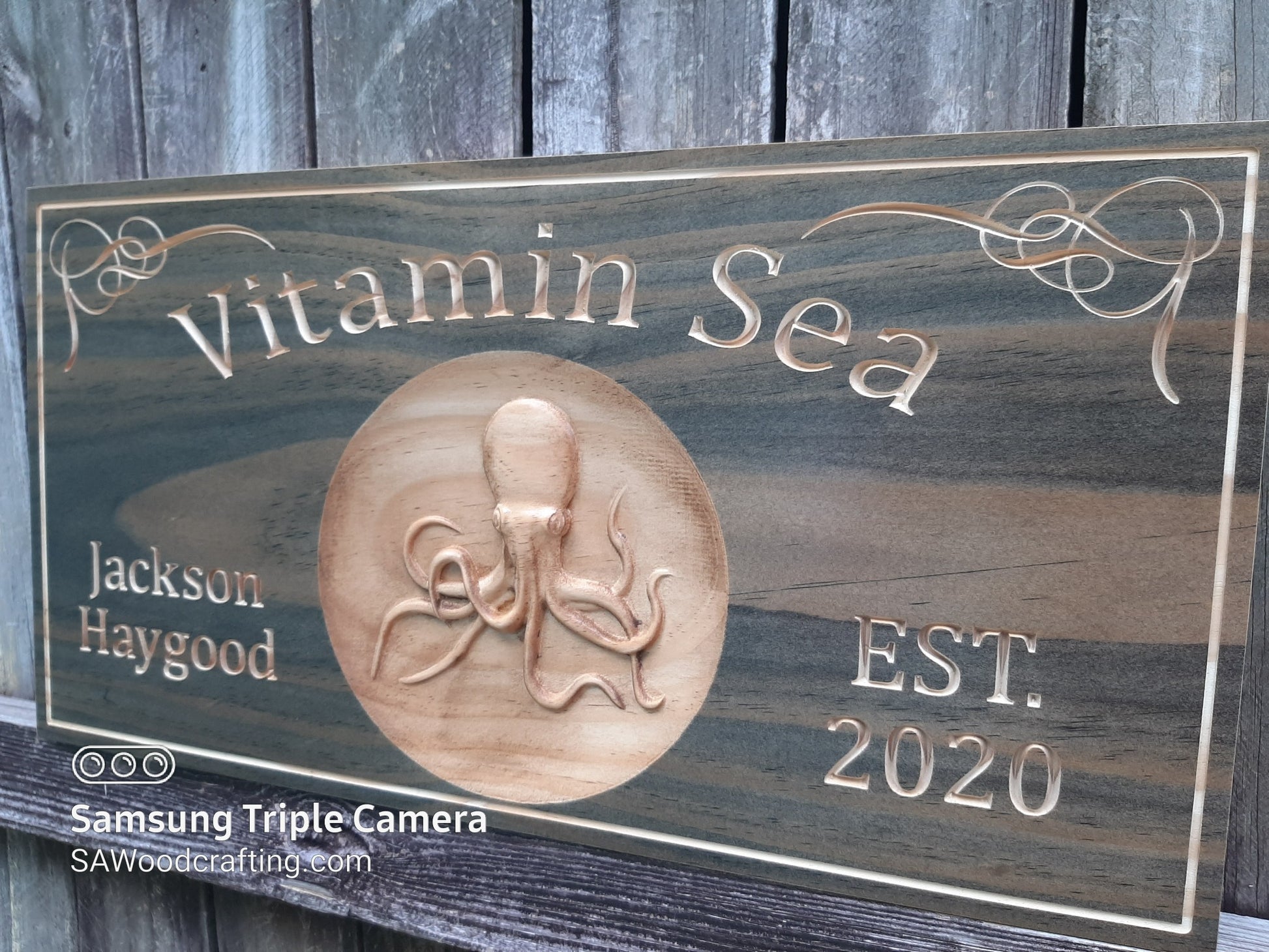 custom wood carved sign with Octopus carving.